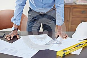Hands, man and drawing on blueprint in table with pencil for planning a building design, layout and project as architect