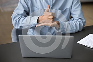 Hands of man with hearing disability talking on video call