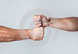 Hands of man people fist bump team teamwork, success. Man giving fist bump. Team concept. People bumping their fists