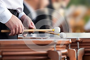 Hands of the man playing the timpani