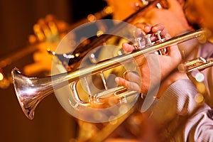 Hands of man playing the trumpet
