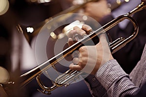 Hands of man playing the trumpet