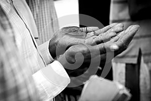 Hands of man praying in South Sudan