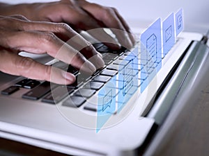 Hands man useing laptop computer with E-commerce technology icons on virtual screen. Business global, social media marketing
