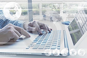 Hands of man using laptop