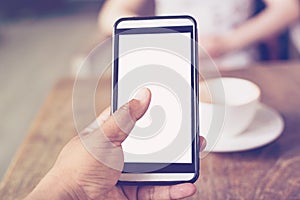 Hands man using phone in coffee shop with depth of F