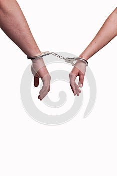 Hands of a man and a woman in handcuffs - relationship concept