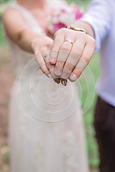 Hands of man and woman with wedding rings