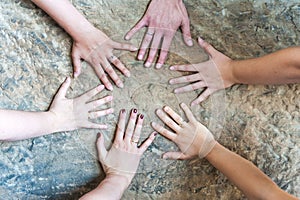 Hands of married women with wedding rings / one women without ring