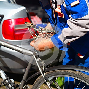 Mechanic replacing a bicycle seat