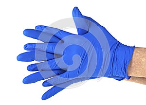 Hands of a medic wearing blue latex gloves, white background