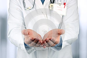 Hands of medical doctor with a stethoscope