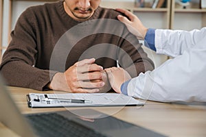 Hands of medical personnel comforting to reassure the patient in clinic