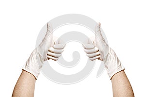 Hands in a medical sterile gloves shows thumbs up approving gesture of consent.