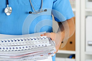 Hands of medicine therapeutist doctor wearing blue uniform