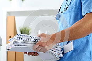 Hands of medicine therapeutist doctor wearing blue uniform