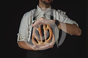 Hands men holding fougas bread