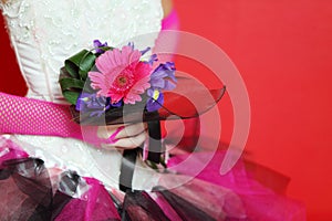 Hands in mesh gloves of bride hold bouquet