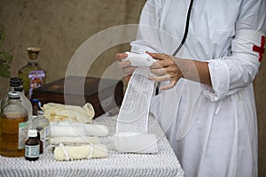 The hands of a military nurse rewinds