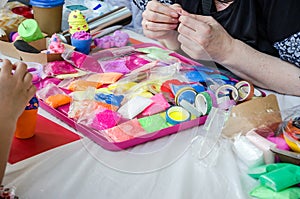 Hands, modeling from soft plasticine, dough. Modeling workshop for children.