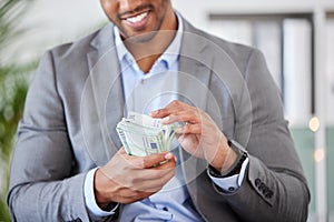 Hands, money and finance with a business man counting cash while accounting or banking in his office. Financial