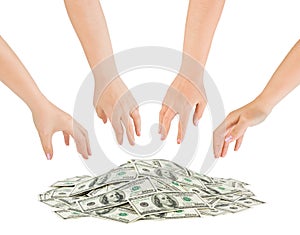 Hands and money heap