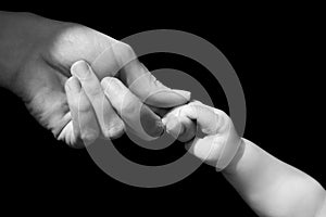 Hands of mother and baby closeup