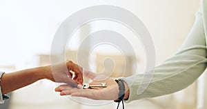 Hands, moving and key by handing over in new home by realtor to owner in sale of property. Closeup, woman and customer