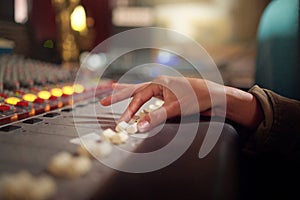 Hands, music mixer and sound board of radio producer, broadcast and scales in studio. DJ equipment, electronic media and