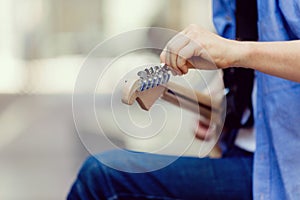 Hands of musician with guitar