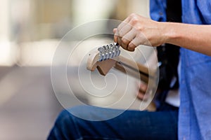 Hands of musician with guitar