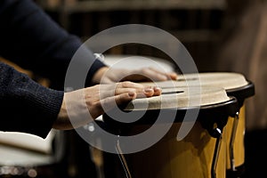 Hands musician playing the bongos