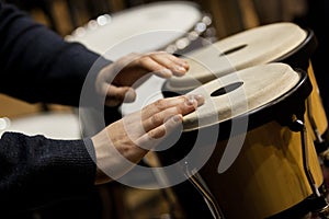 Hands musician playing the bongos