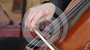 Hands of musician playing cello close up FDV