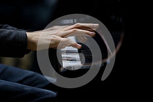 Hands musician playing the piano