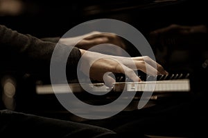 Hands musician playing the piano