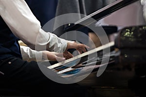 The hands of a musician playing the piano