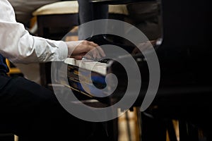 The hands of a musician playing the piano