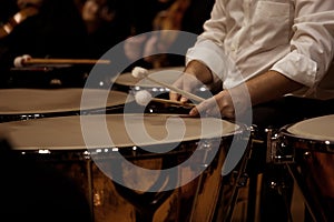 Hands musician playing the timpani