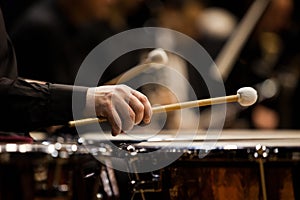 Hands musician playing the timpani photo