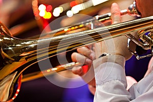 Hands musician playing the trombone