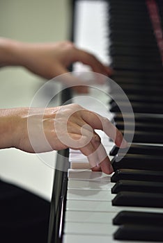 The music hands at the piano photo