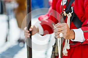 Hands of a musketeer holding a musekt