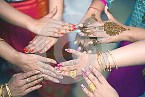 Hands nail polish different colors . mehendi hands . .