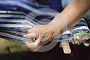 Hands native women make a textil craft photo