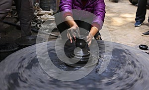 Hands of a Nepalese pottery