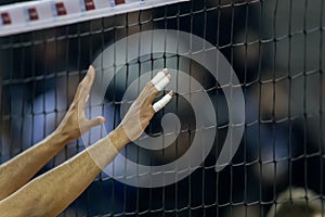 Hands on net during the Hellenic Volleyball League game