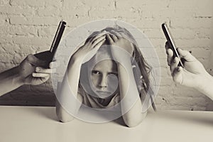 Hands of network addict parents using mobile phone neglecting little sad ignored daughter bored photo