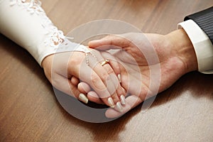 Hands of newly-married couple