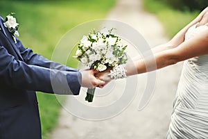 Hands of a newly wed couple together